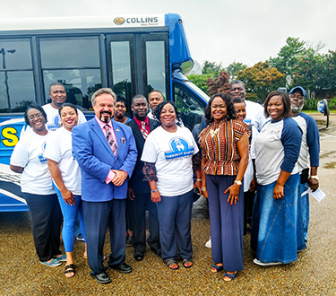 Opportunity Bus picture with Community Relations staff, Mentoring staff, and ANC President Dr. James Shemwell